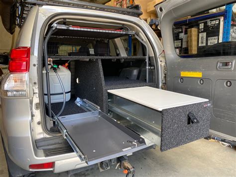 prado 150 overseat storage.